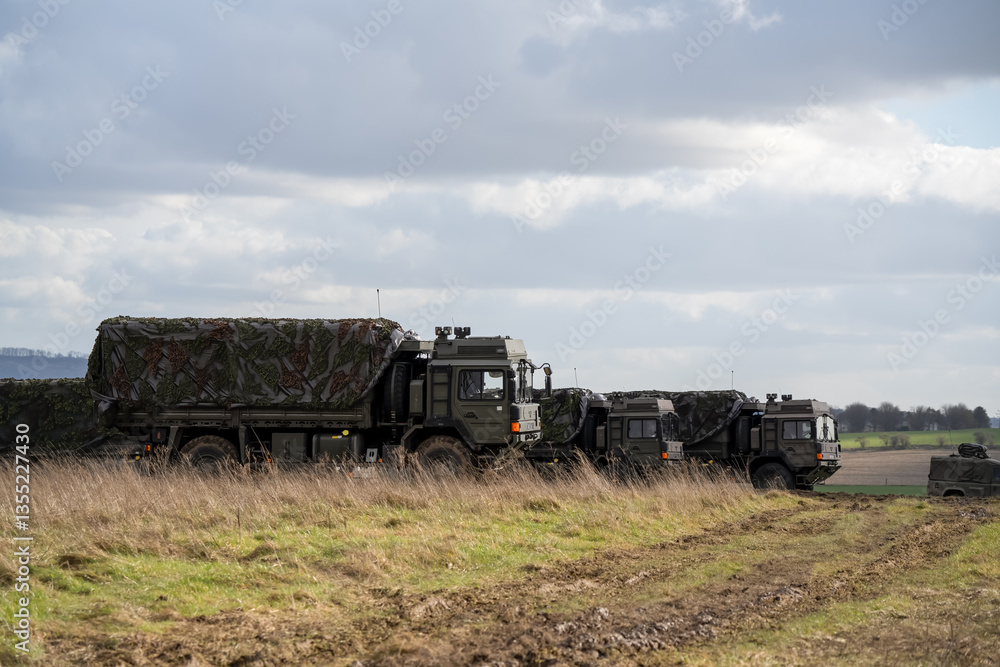 several British army MAN SV 4x4 utility truck on a military exercise