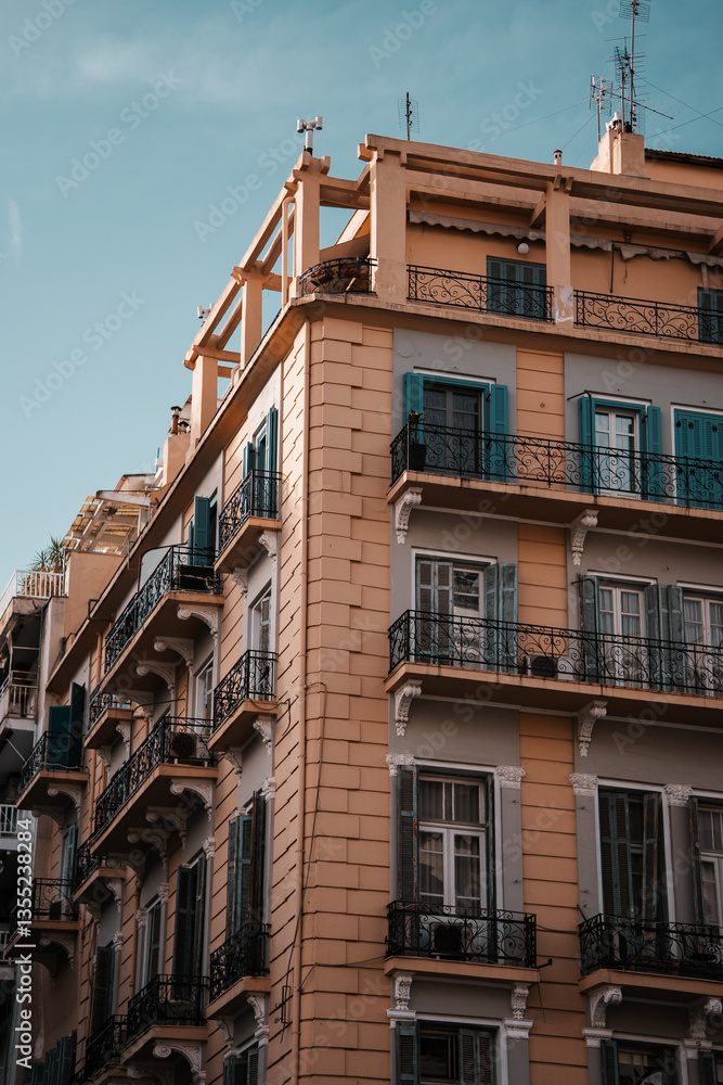 Fototapeta premium Beautiful European apartment building facade windows and balcony