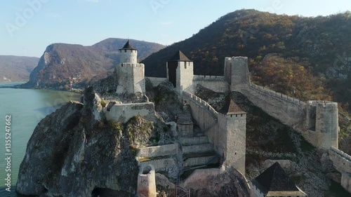 Embark on a mesmerizing aerial tour around Golubac Fortress. Witness dramatic rocky formations and the mighty Danube as the camera captures the stunning interplay of nature and history.