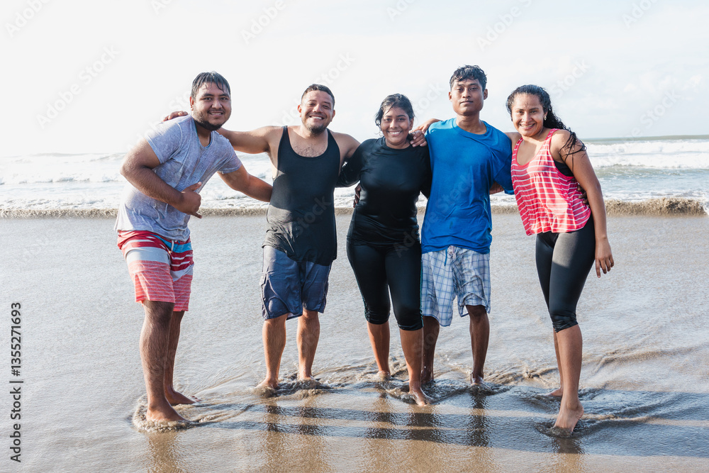 Obraz premium portrait of latin friends having fun at beach at pacific ocean in Acapulco Mexico Latin America, hispanic young people women and men