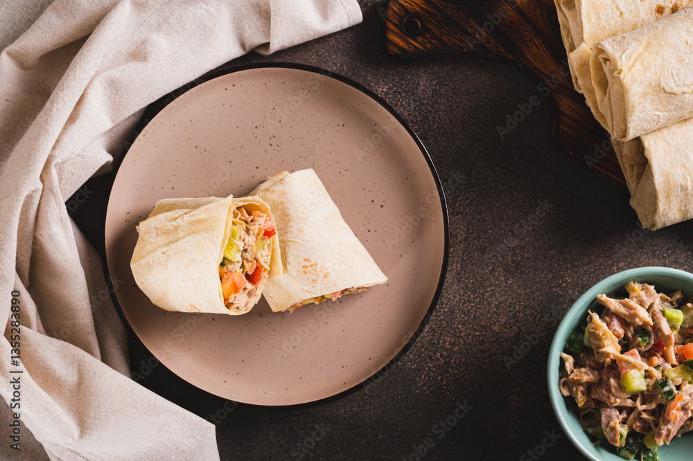 Homemade shawarma with chicken, tomato and cucumber in pita bread top view