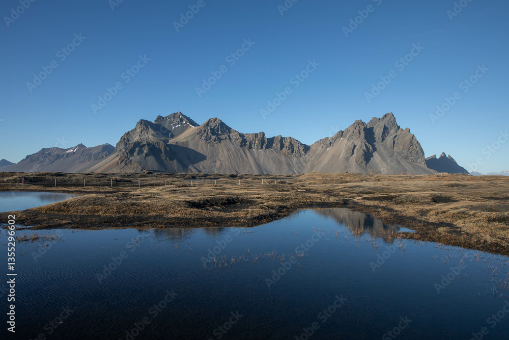 Vestrahorn mountain in Iceland and its reflection Vestrahorn mountain in Iceland and its reflection