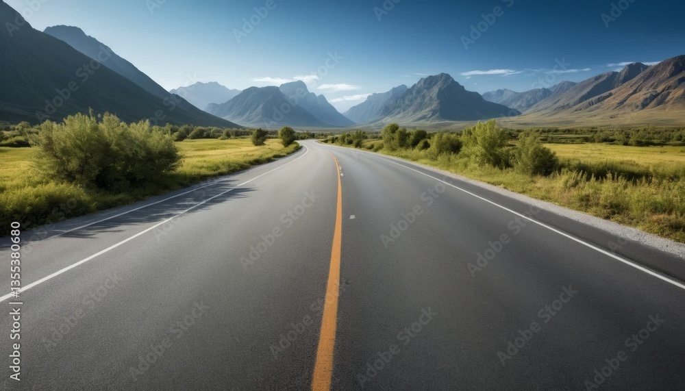 Fototapeta premium Scenic Asphalt Road Through Mountain Valley Under Bright Blue Sky