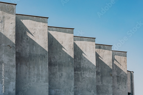 Staggered Concrete Facade with Dramatic Angular Shadows