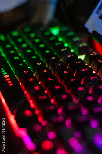 Vibrant RGB gaming keyboard, blurred for a dynamic feel. Perfect for tech, gaming, and design projects. Add a modern, energetic touch to your visuals photo