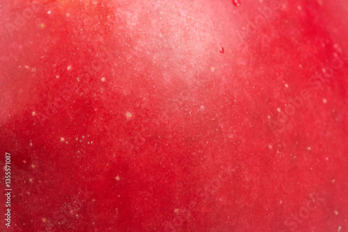 Red apple texture as background. Apple skin macro photo.