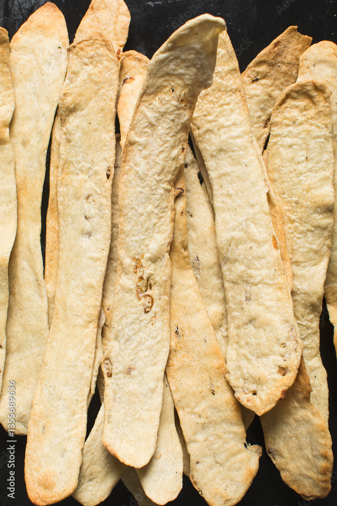 Overhead view of homemade crackers, top view of freshly baked onion cracker biscuits, process of making flatbread onion crackers Overhead view of homemade crackers, top view of freshly baked onion cracker biscuits, process of making flatbread onion crackers