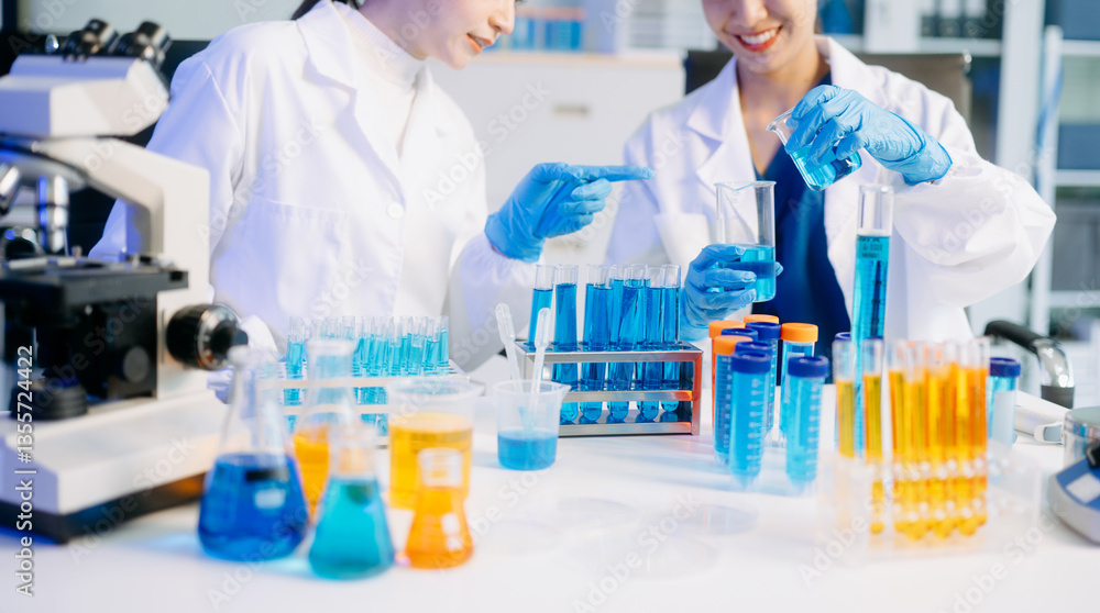 Fototapeta premium Young scientists conducting research investigations in a medical laboratory, a researcher