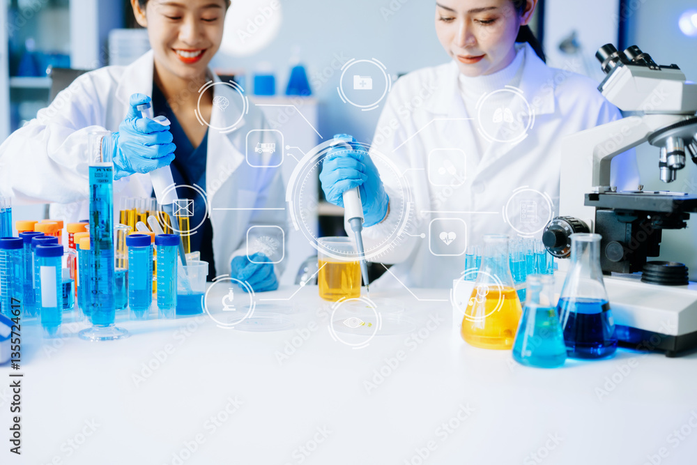 Fototapeta premium Two Asian female scientists conduct biochemical research using micro pipettes in a high-tech medical lab