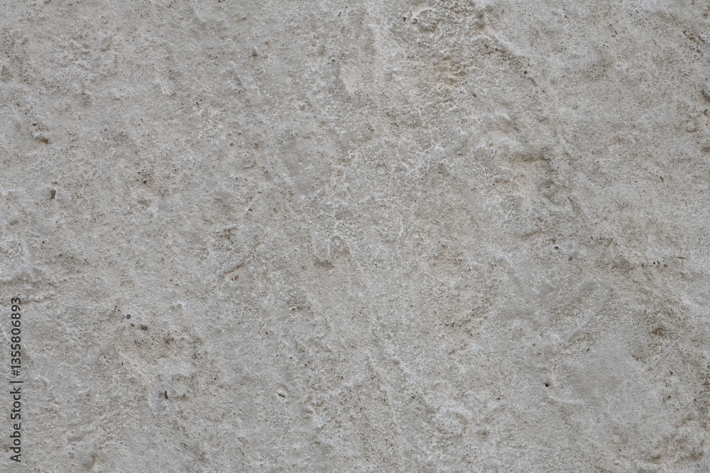 Obraz premium Texture of old dirty concrete plaster. Surface of a carelessly smoothed concrete wall or floor with traces of whitewashing, pattern, background, high resolution.