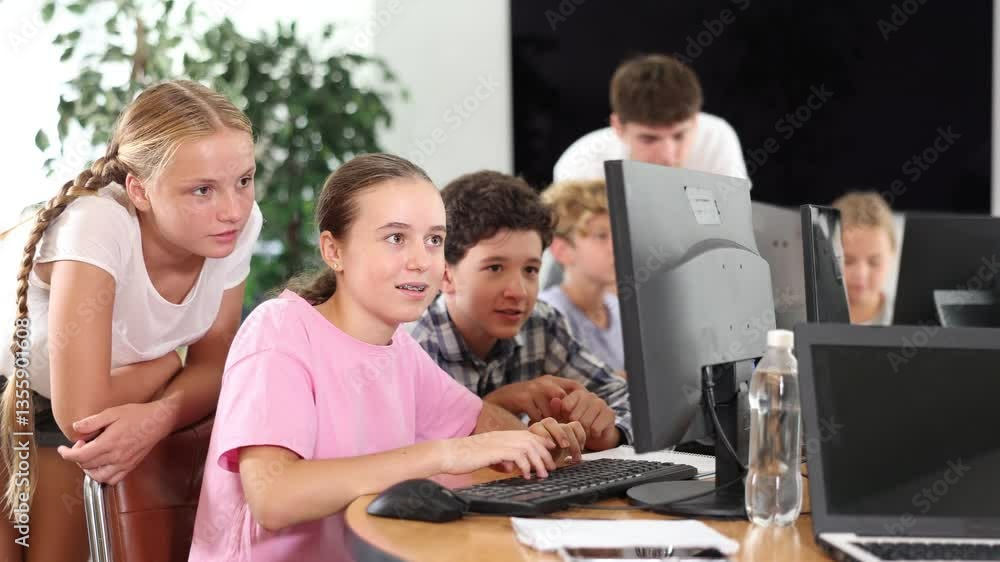 Group of children students learn to work with computer at lesson Group of children students learn to work with computer at lesson