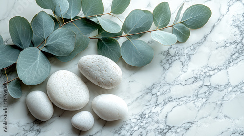 White Spa Stones and Eucalyptus on Marble Background Wallpaper
