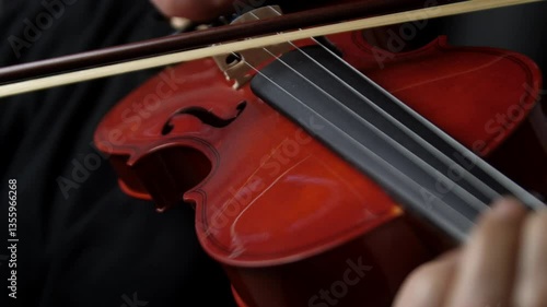 Violin being played in slow motion. Close up, shallow depth of field.