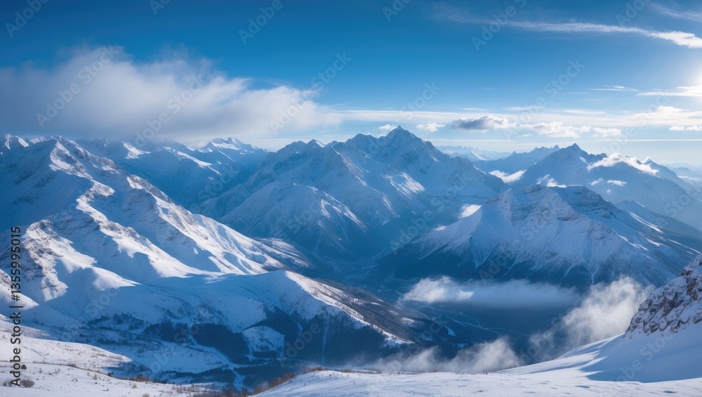 Stunning perspective of the snowy mountains and valley during a sunny winter day. Cold winds blow over the peaks. Panoramic view of snow-covered mountain range. Stunning perspective of the snowy mountains and valley during a sunny winter day. Cold winds blow over the peaks. Panoramic view of snow-covered mountain range.