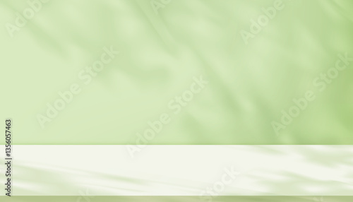 Shadow leave and blur gradient light on green studio background wall room and podium stage for product,Summer or Spring banner green pastel with abstract sunlight on floor texture