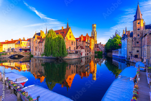 Fotografie Bruges, Belgium: Sunset view of the Dijver river canal and Belfortower Belfry fr