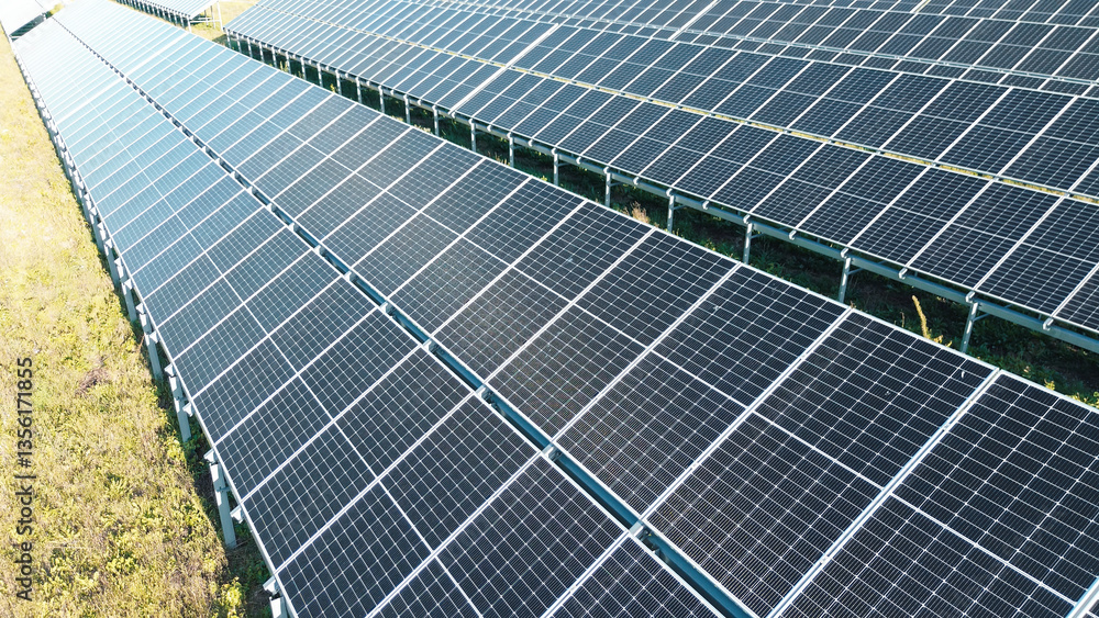 Solar panel array in agricultural field producing electricity Solar panel array in agricultural field producing electricity