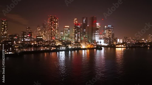Wallpaper Mural Drone flying towards Canary Wharf over River Thames. Finance hub of London Torontodigital.ca