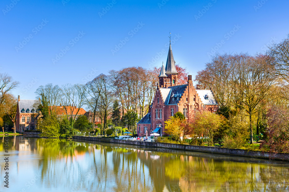 Naklejka premium Panorama with Flemish style building reflecting in Minnewater lake, Bruges, Belgium