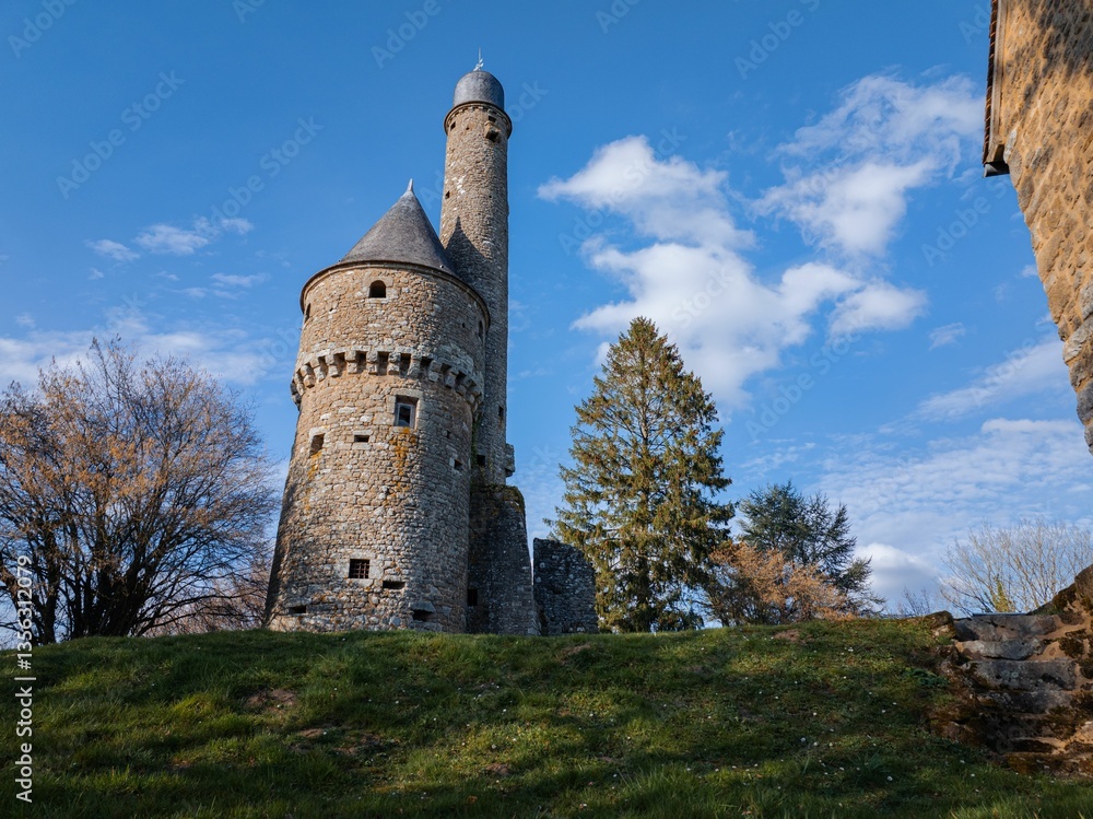 Medieval stone tower under a blue sky. Medieval stone tower under a blue sky.