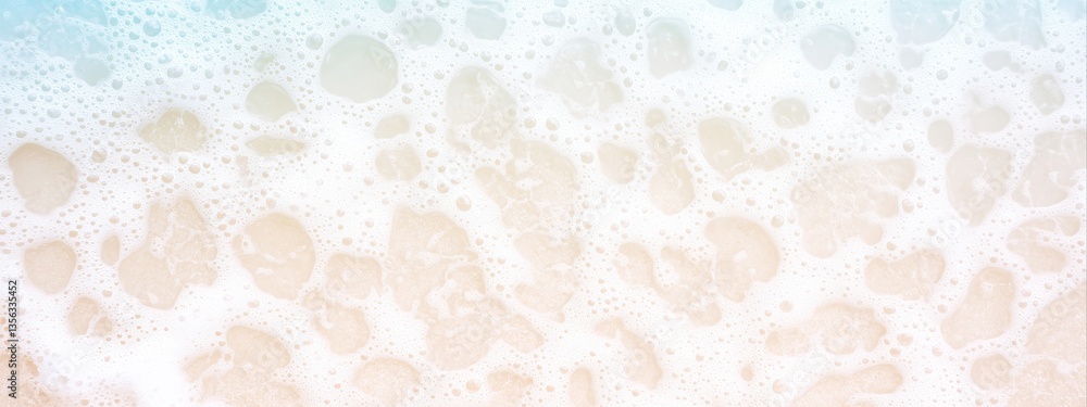 Fototapeta premium White foam waves washing onto light beige sandy beach. Aerial beach image for banner with copy space. Summer vacation and tropical paradise concept.