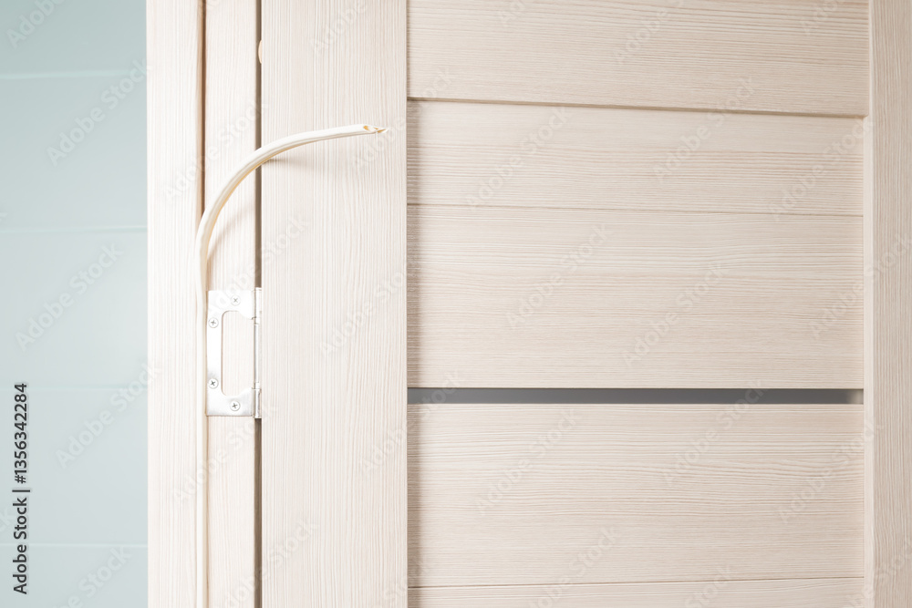installation of a rubber door seal in a house, close-up installation of a rubber door seal in a house, close-up