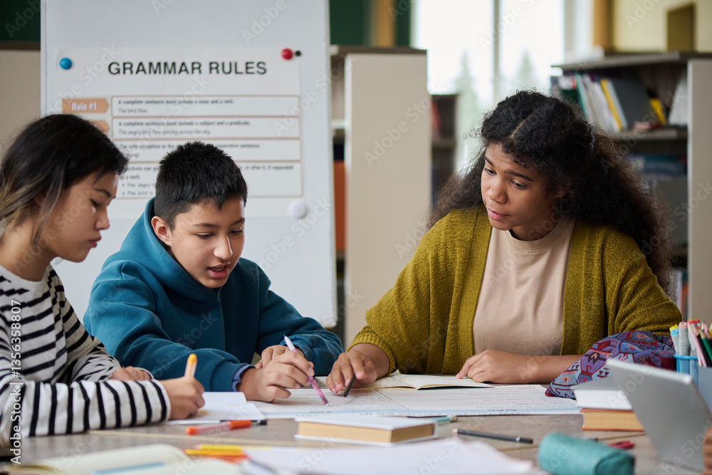 Intercultural children studying together in a classroom setting Intercultural children studying together in a classroom setting