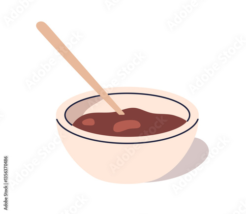 Chocolate syrup served in bowl with spoon. Sweet melted cocoa spread, liquid ...