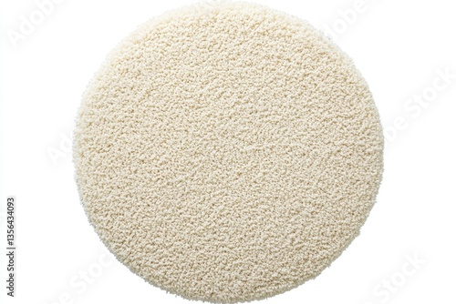 Top view of a soft round shaggy rug in cream color with a textured surface and a cozy inviting feel for home decor and interior design
