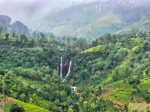 View from above of the misty mountains and Mantenga Waterfalls in Elulwini valley, Swaziland, Southern Africa