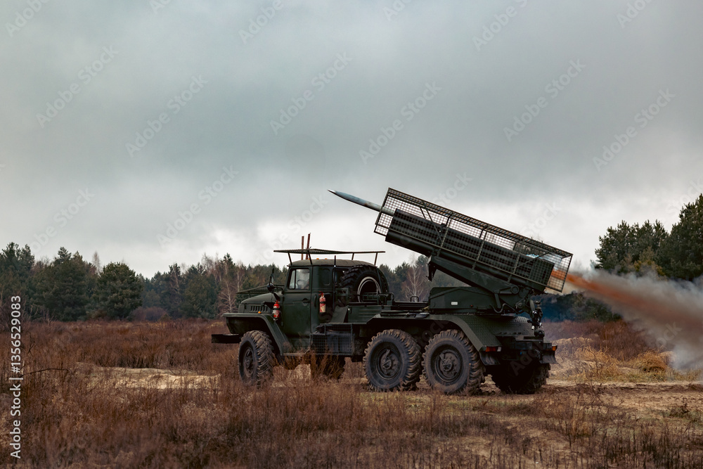 Multiple launch rocket system In combat conditions on the battlefield Multiple launch rocket system In combat conditions on the battlefield