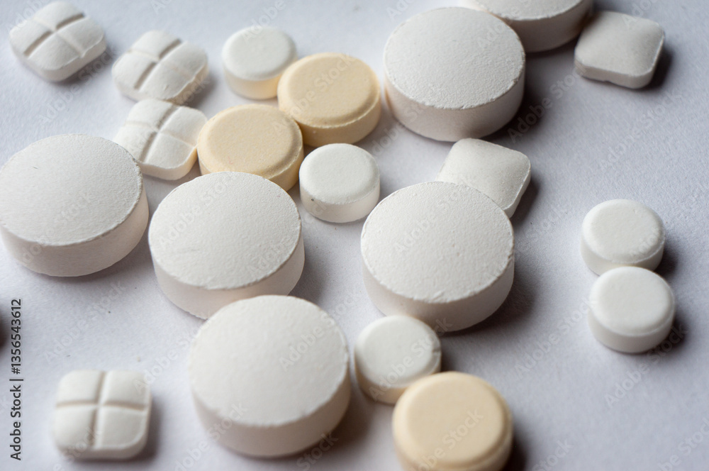 Medical tablets are scattered on the surface Medical tablets are scattered on the surface