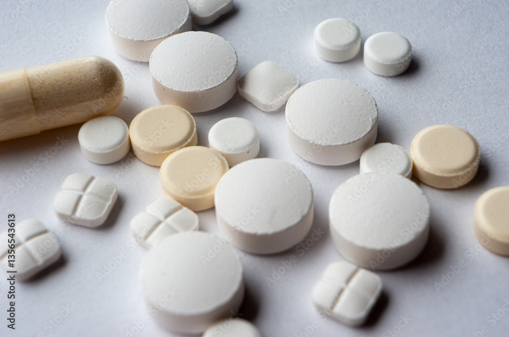 Medical tablets are scattered on the surface Medical tablets are scattered on the surface