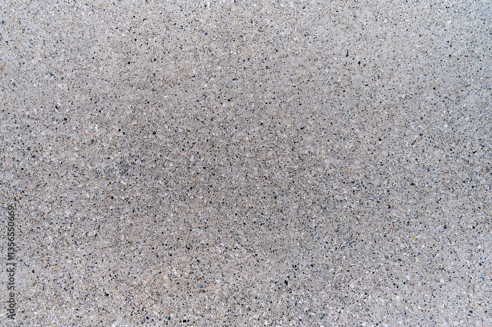 Close-up view of a smooth gray concrete surface showcasing its subtle texture and uniform color ideal for design.