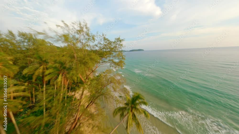 Cinematic FPV drone flight over scenic tropical beach and turquoise sea at sunset on Koh Kood island in Thailand Cinematic FPV drone flight over scenic tropical beach and turquoise sea at sunset on Koh Kood island in Thailand