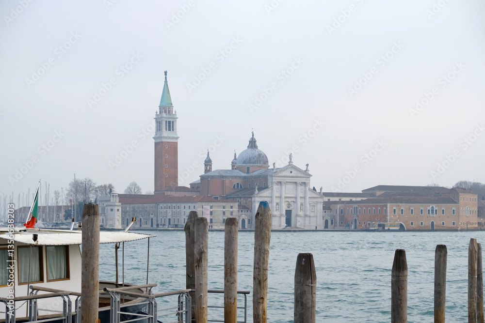 Fototapeta premium Church of San Giorgio Maggiore - La Сhiesa di San Giorgio Maggiore - on the island in Venice, view from the water. Historical landscape of Venice, atmosphere of travel.