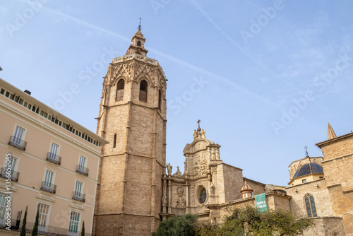 Wallpaper Mural Valencia Cathedral and Miguelete Tower (Micalet) from Plaza de la Reina, Spain. A Gothic masterpiece standing tall, framed by the lively ambiance of one of Valencia’s most iconic squares. Torontodigital.ca