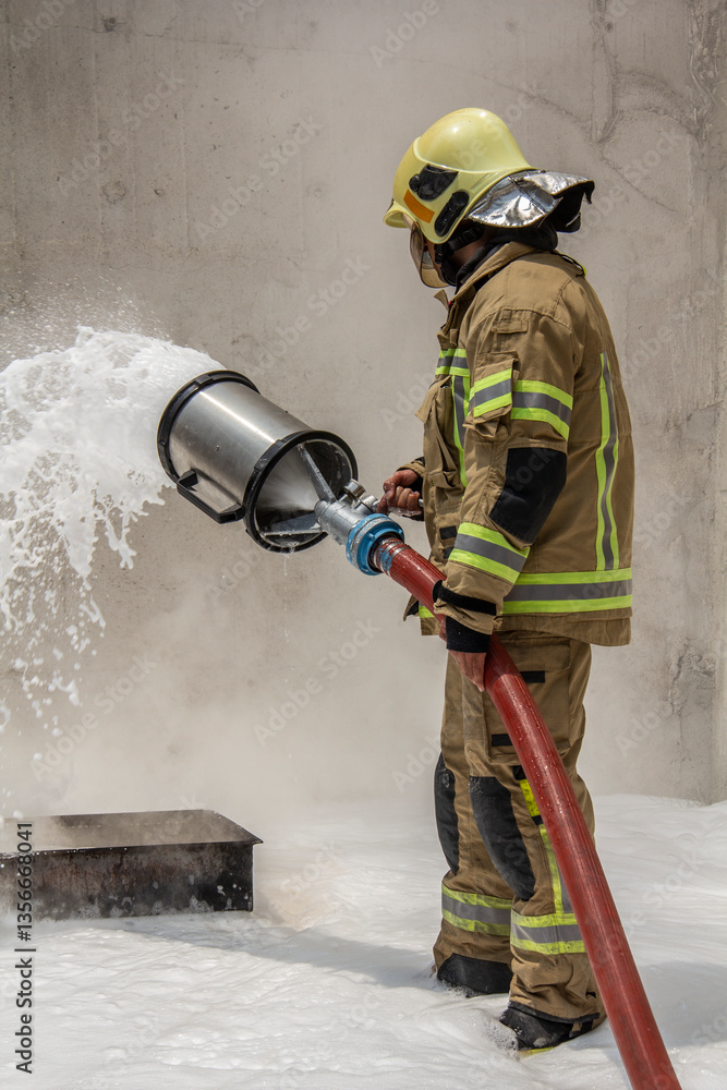 Fototapeta premium a firefighter who puts out fires with foam for public education and demonstration to ordinary people for public education