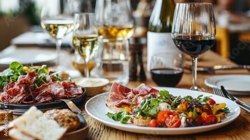 Guests indulge in a delightful assortment of cured meats, fresh salads, and flavorful wines, creating a vibrant atmosphere as the sun sets outside. Laughter and conversation fill the air