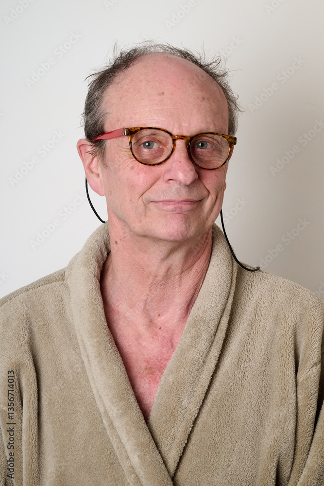 Old man beige bathrobe and tousled hair
