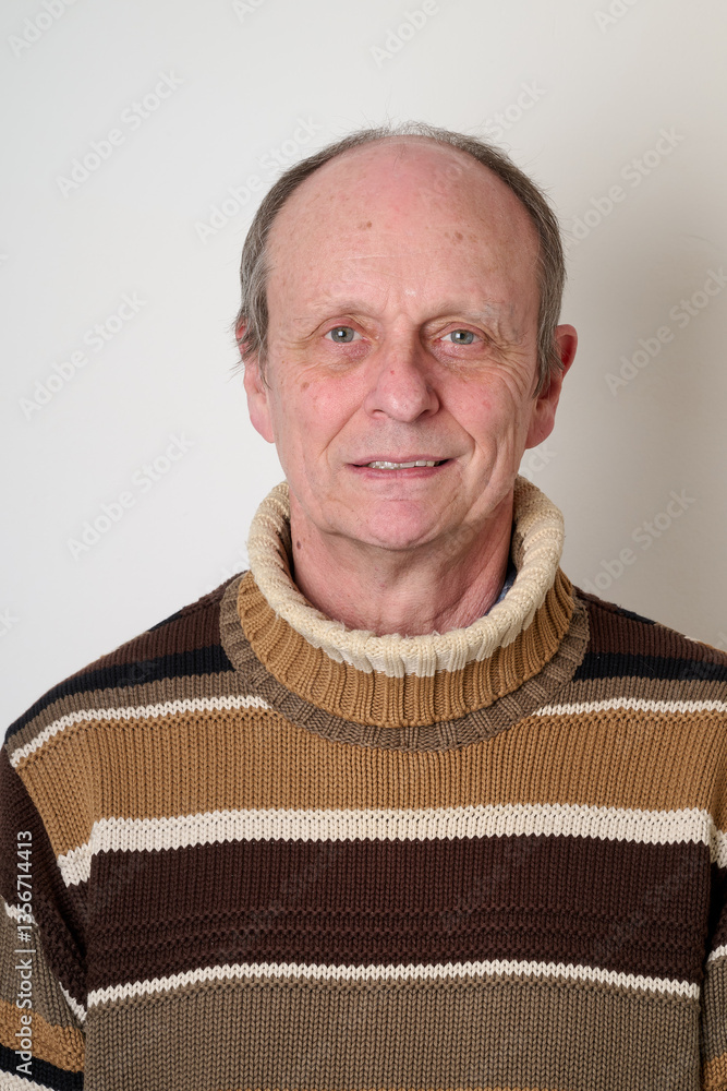 Senior man with a beige turtleneck puulover