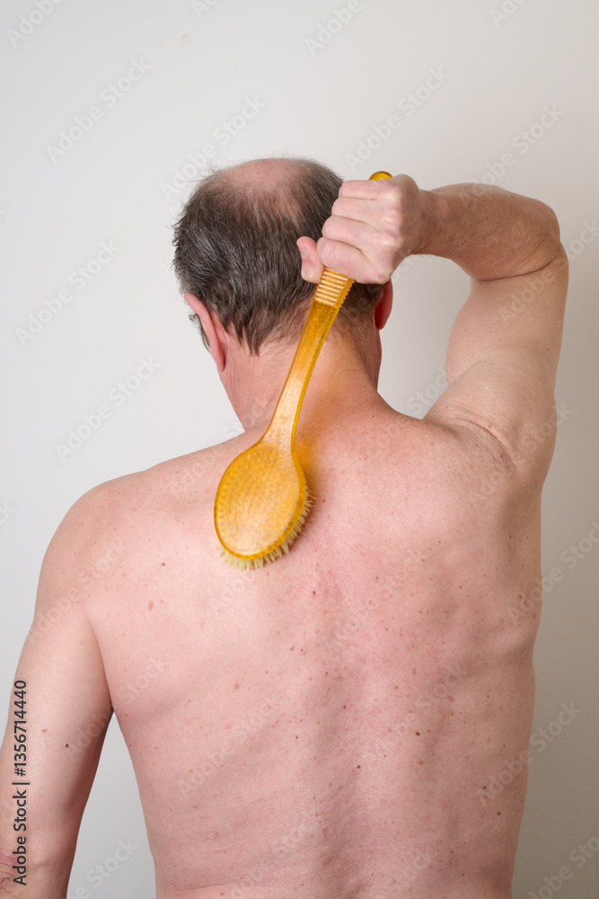 Portrait of man in the bath against white background