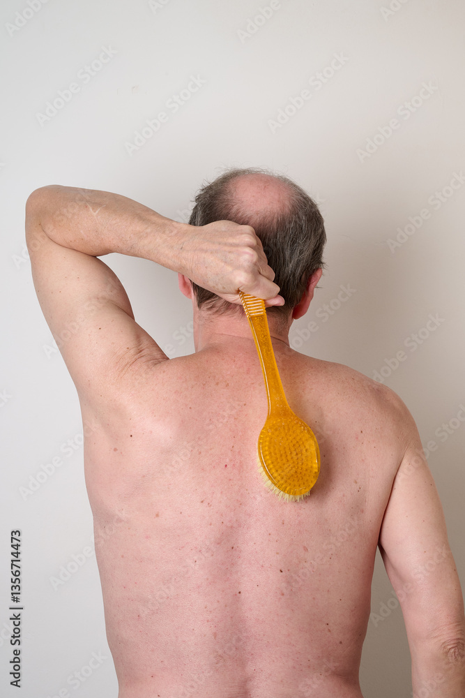 Portrait of man in the bath against white background