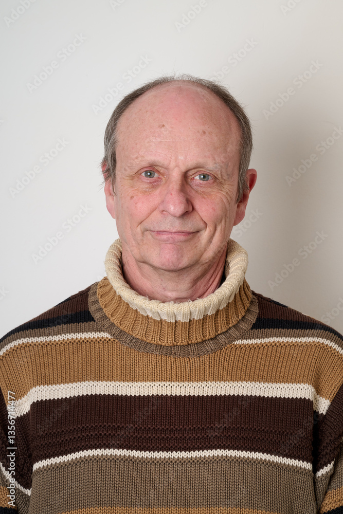 Senior man with a beige turtleneck puulover