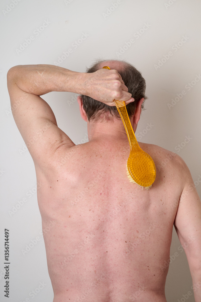 Portrait of man in the bath against white background
