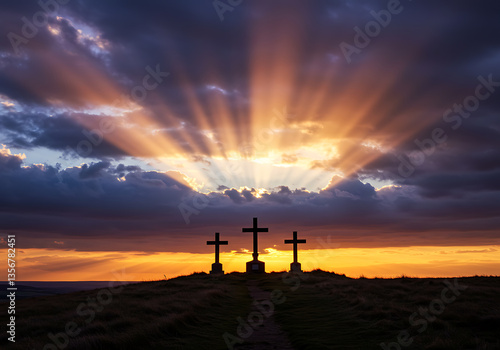 Wallpaper Mural Silhouetted crosses atop a grassy hill catch the last golden rays of the setting sun. Torontodigital.ca