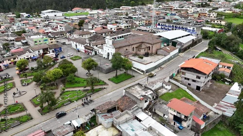 aerial video of the town pintag with background of green mountains in ecuador
