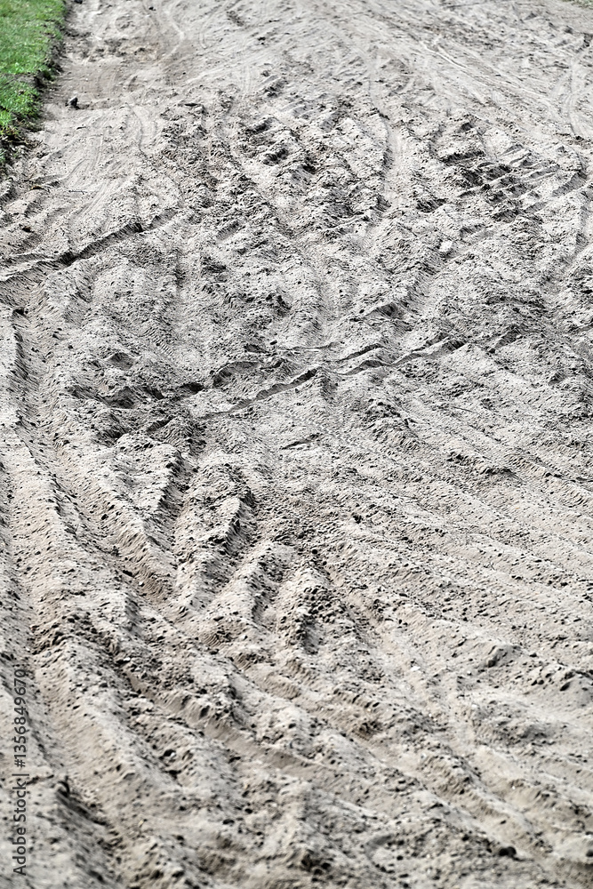 Multiple Bicycle tire tracks in a sandy road
