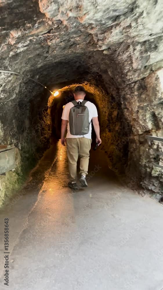Embarking on an exhilarating journey to explore a mysterious pathway through a cave Embarking on an exhilarating journey to explore a mysterious pathway through a cave