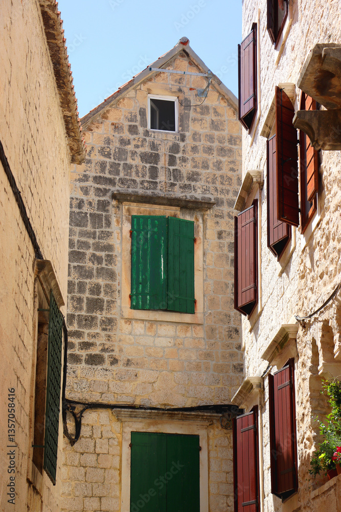 Picturesque Mediterranean street and traditional architectural details in Trogir, Croatia.